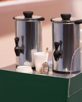 Styled image of the Tea Bag Charm and Cereal Spoon Charm.