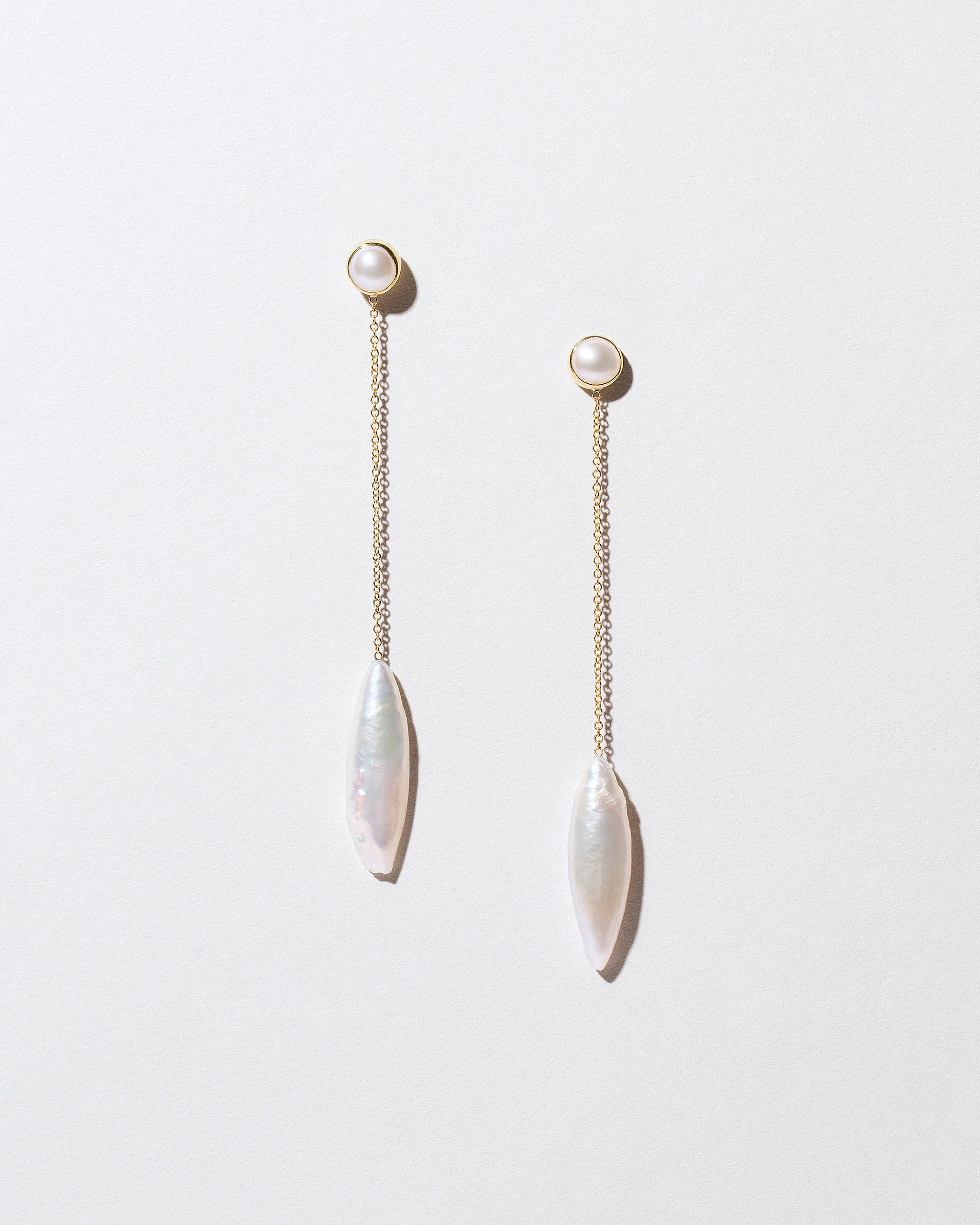  Navette Pearl Drop Earrings on light color background.