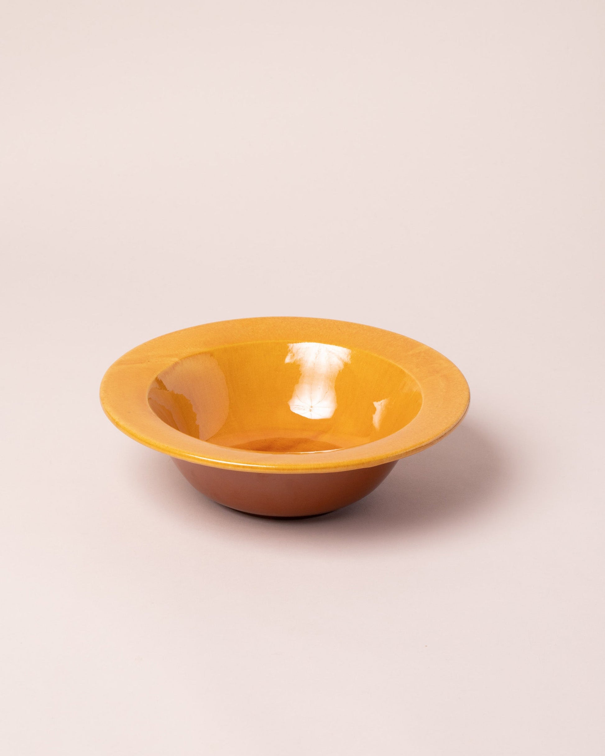 La Ceramica Vincenzo Del Monaco Caramel Yellow First Course Bowl on light color background.