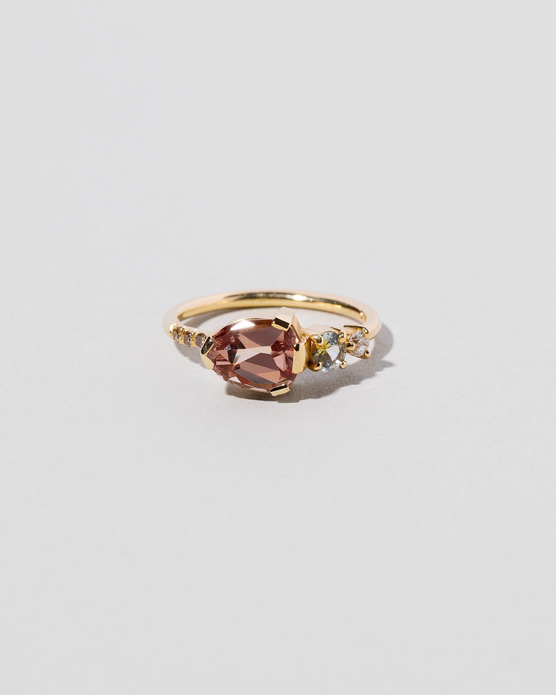  Garnet & Diamond Ring on light color background.