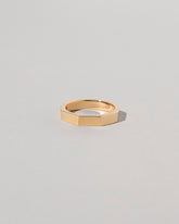 Gold 4mm Segmented Half Hoop Band on light color background.
