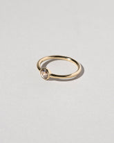 View from the side of the Rose Cut Champagne Diamond Ring on light color background.