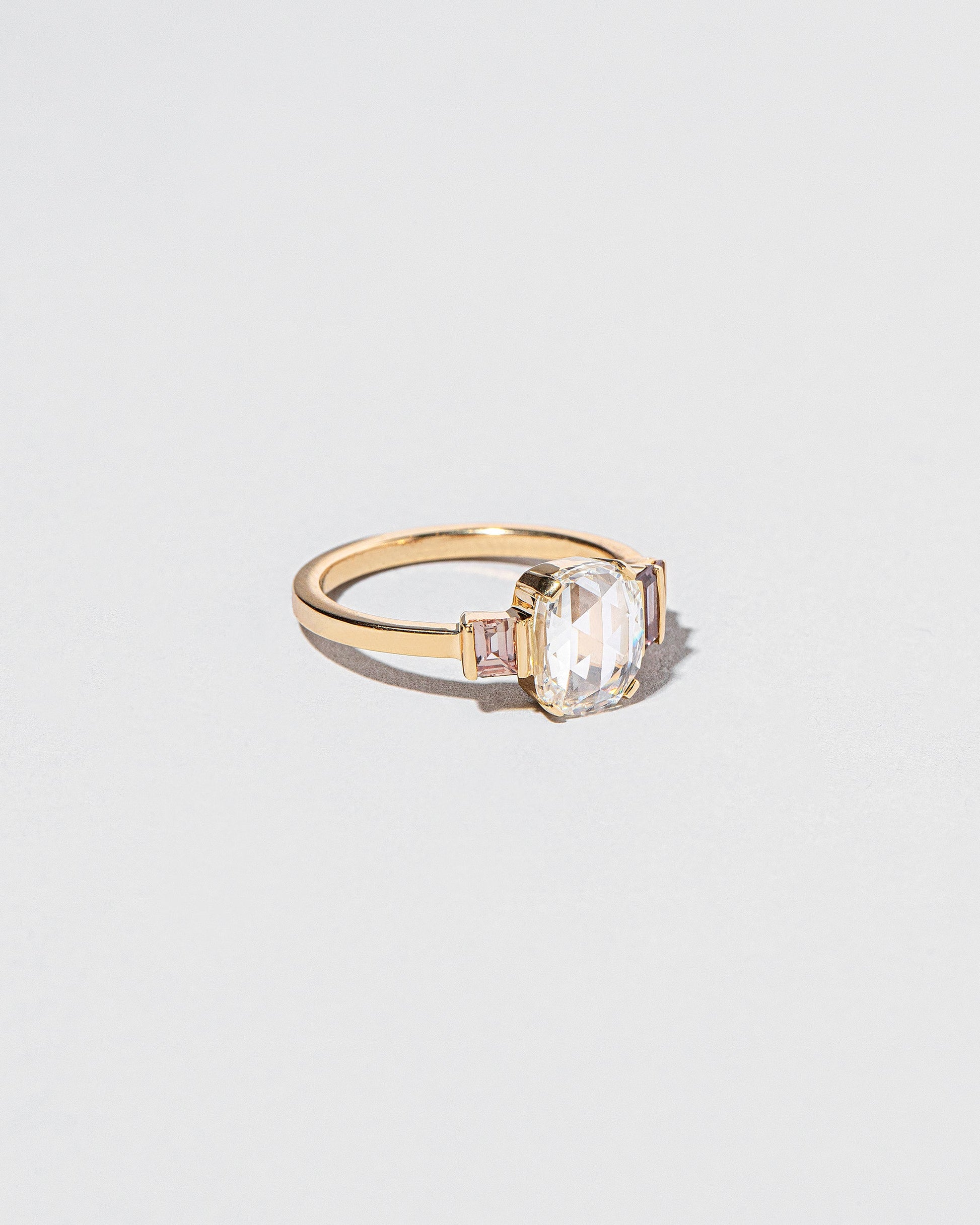  One & The Others Ring on light color background.