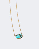 In-Between Necklace on light color background.