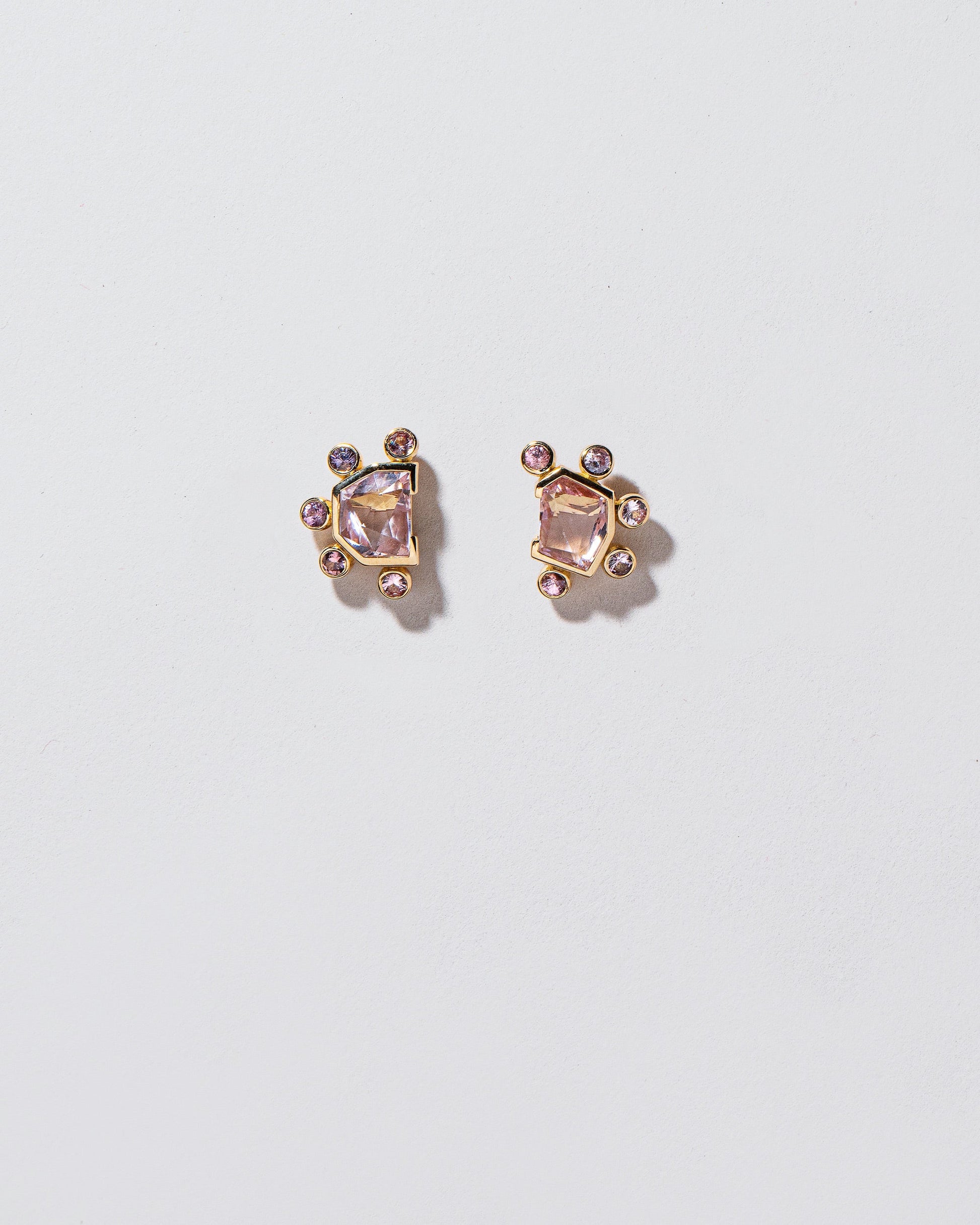 Comparison Earrings on light color background.