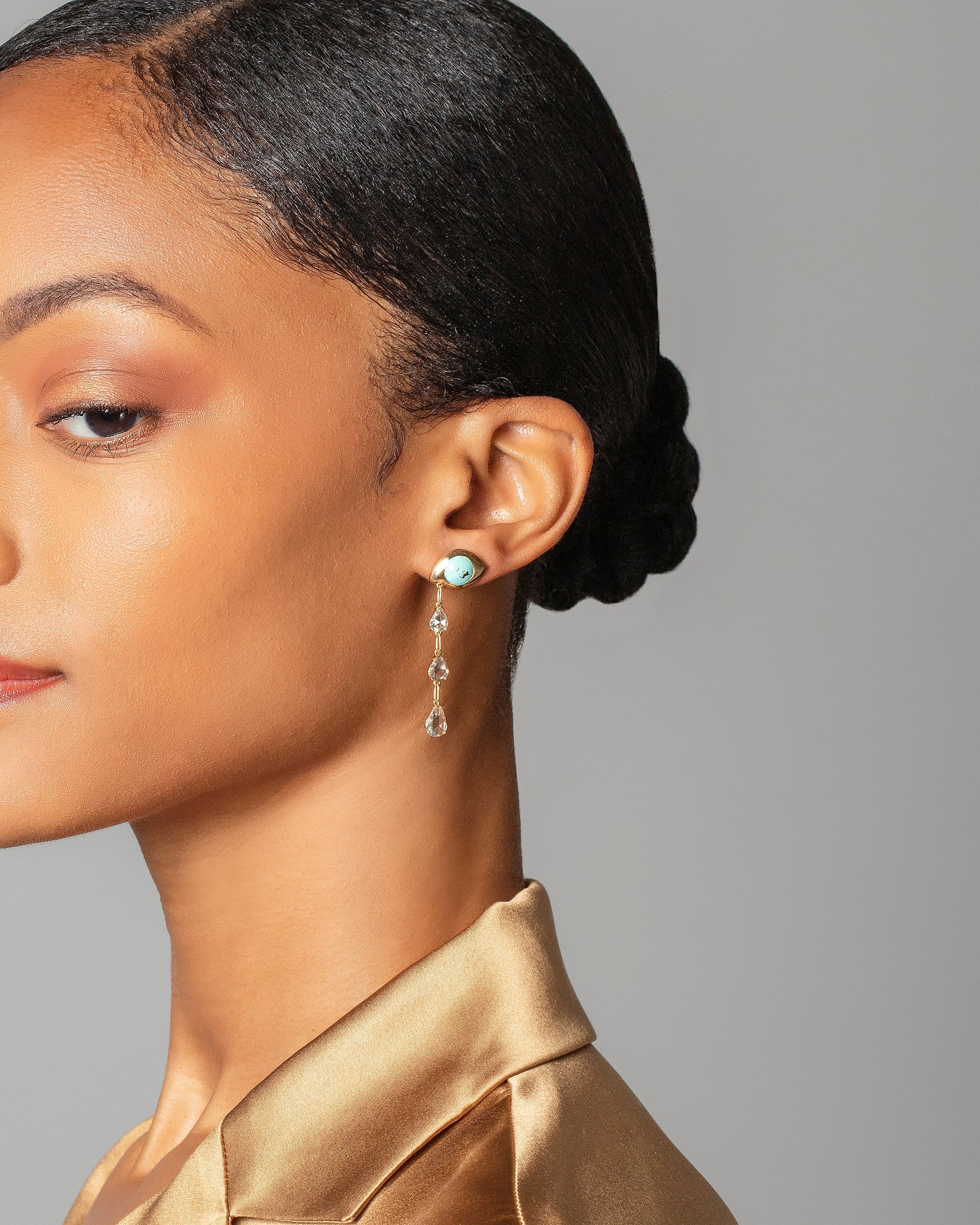 Turquoise Transformation Earrings on model.