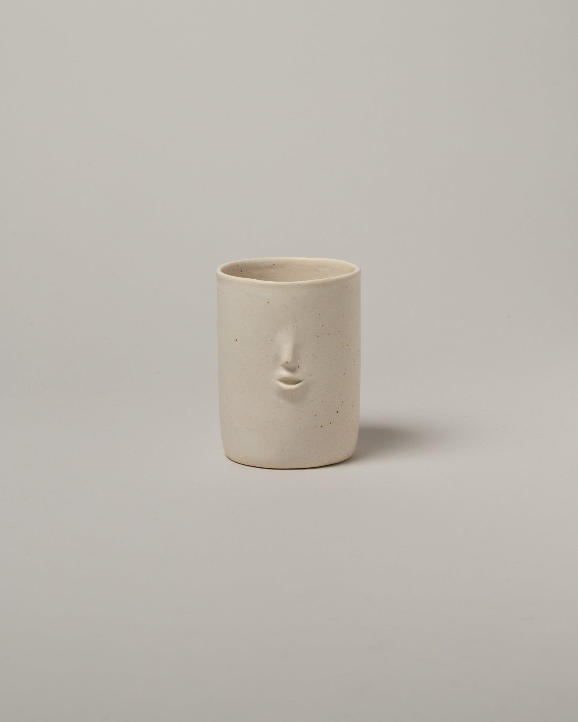 Rami Kim Matte Speckled Oatmeal Mini Face Tumblers on light color background.