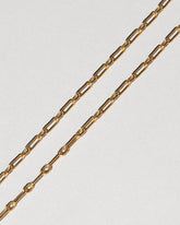 Hotdog Chain Necklace on light color background.