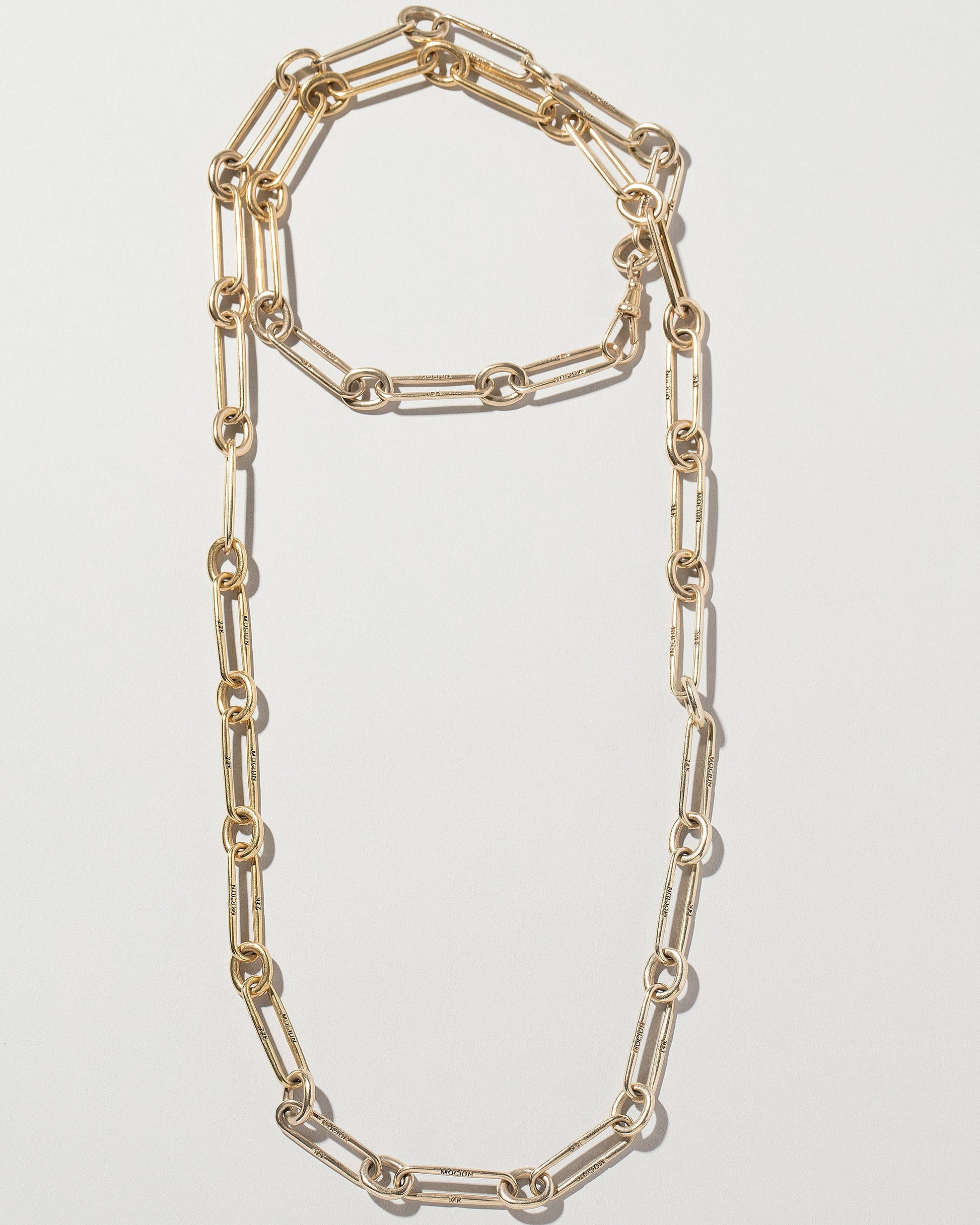 Customized 34" version of the Link Necklace on light color background.
