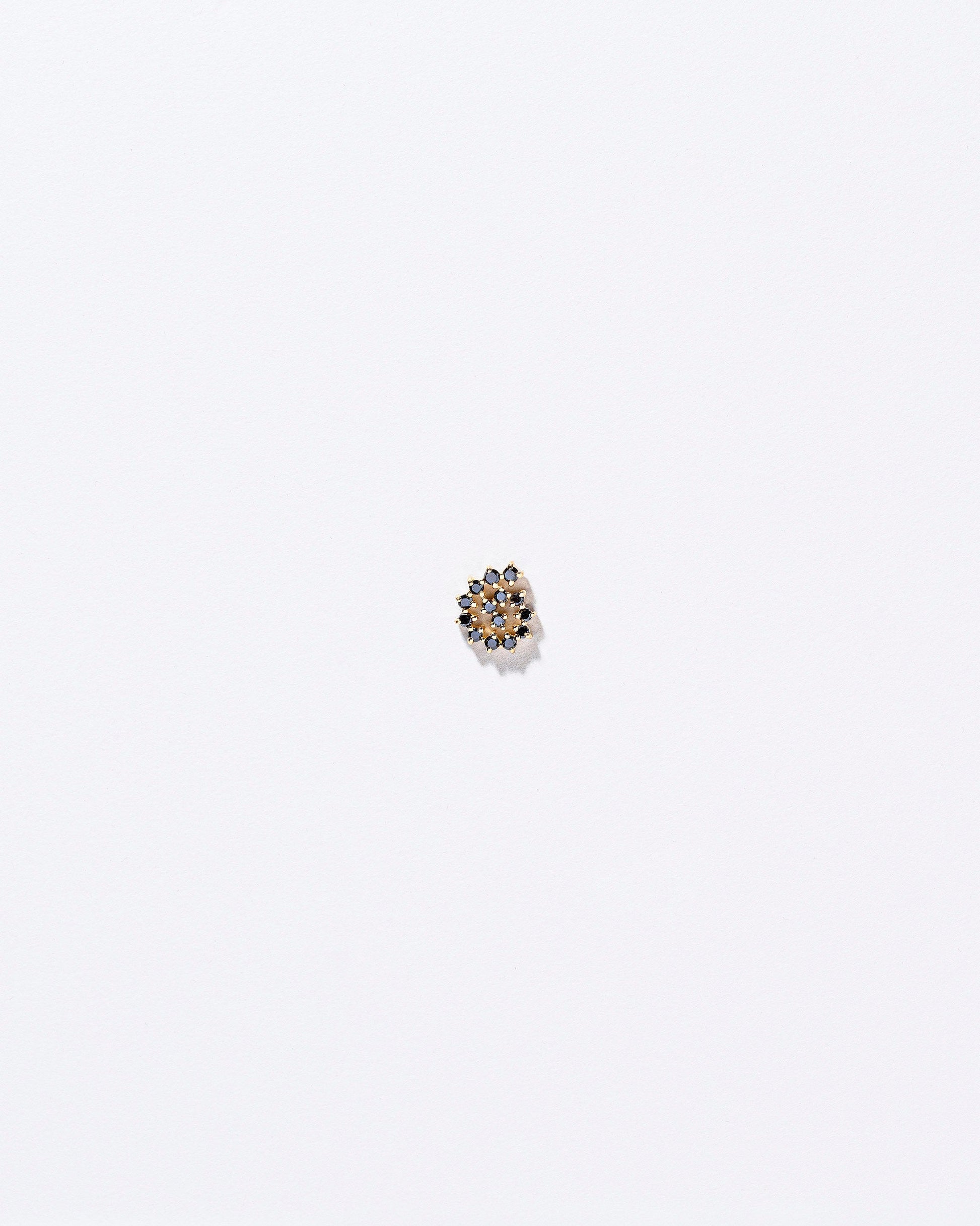 Spiral Earring Single Stud on light colored background.