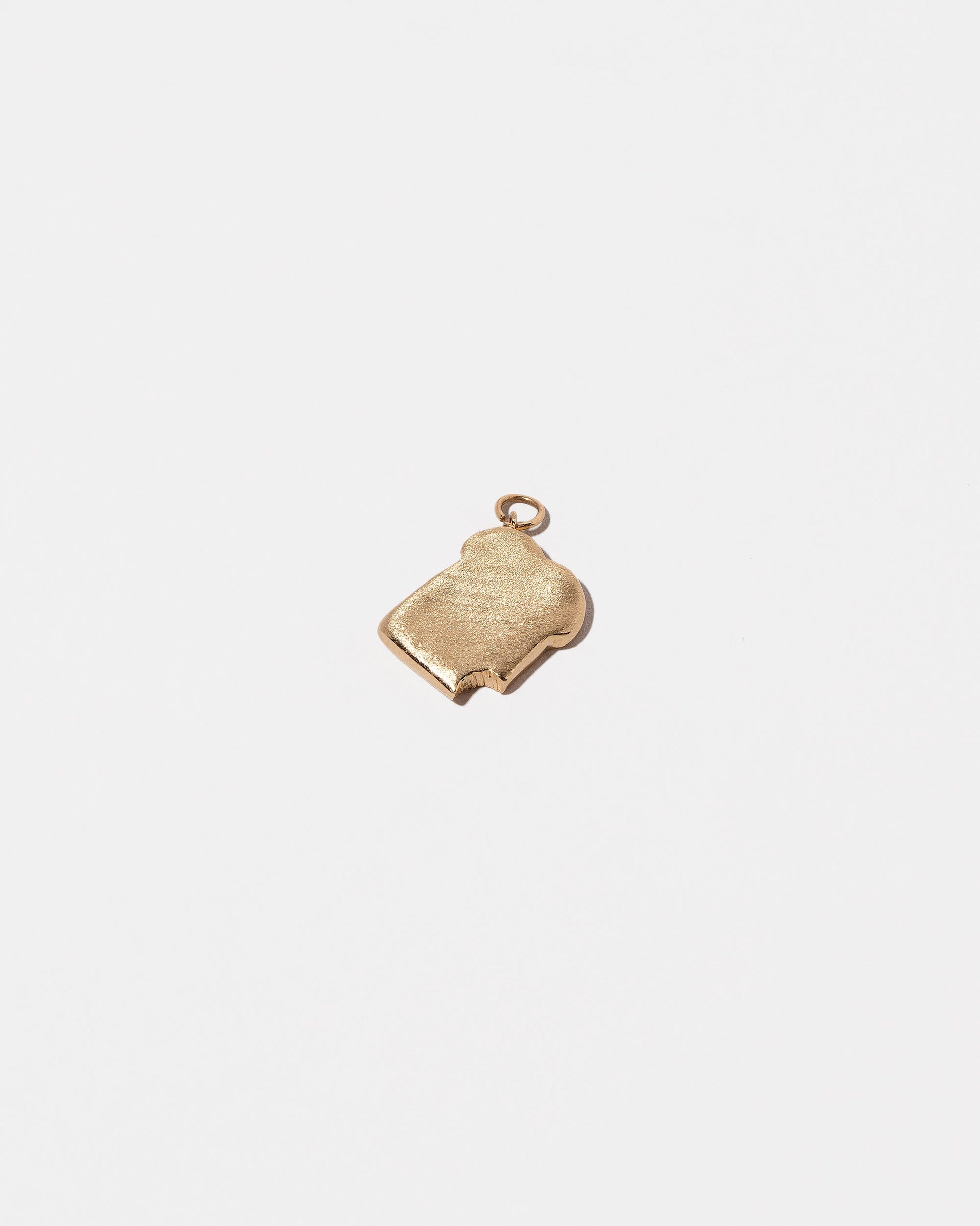  Toast Charm - with a Bite on light color background.