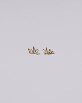 Right Snake Stud Earring Single and Left Snake Stud Earring Single on light color background.