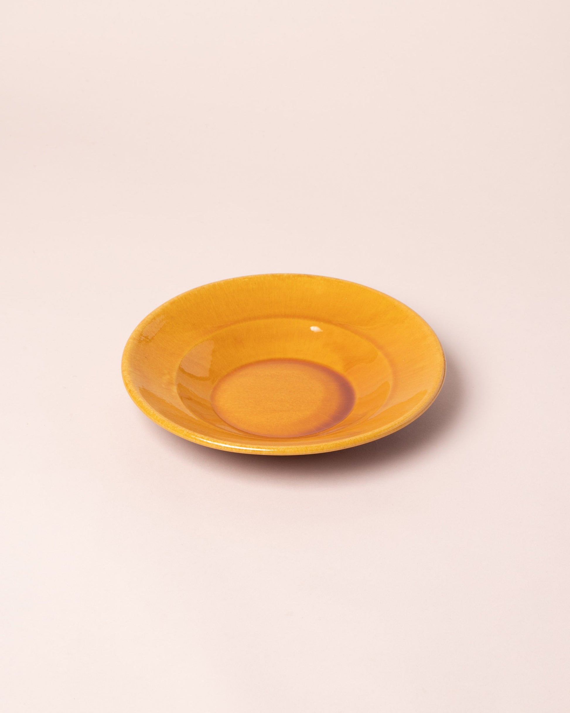  Del Monaco Shallow Bowl on light color background.
