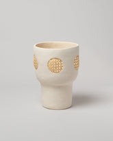 Stephanie Phillips Cream Rattan Vessel on light color background.