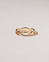 Gold Connected Eye Band on light color background.