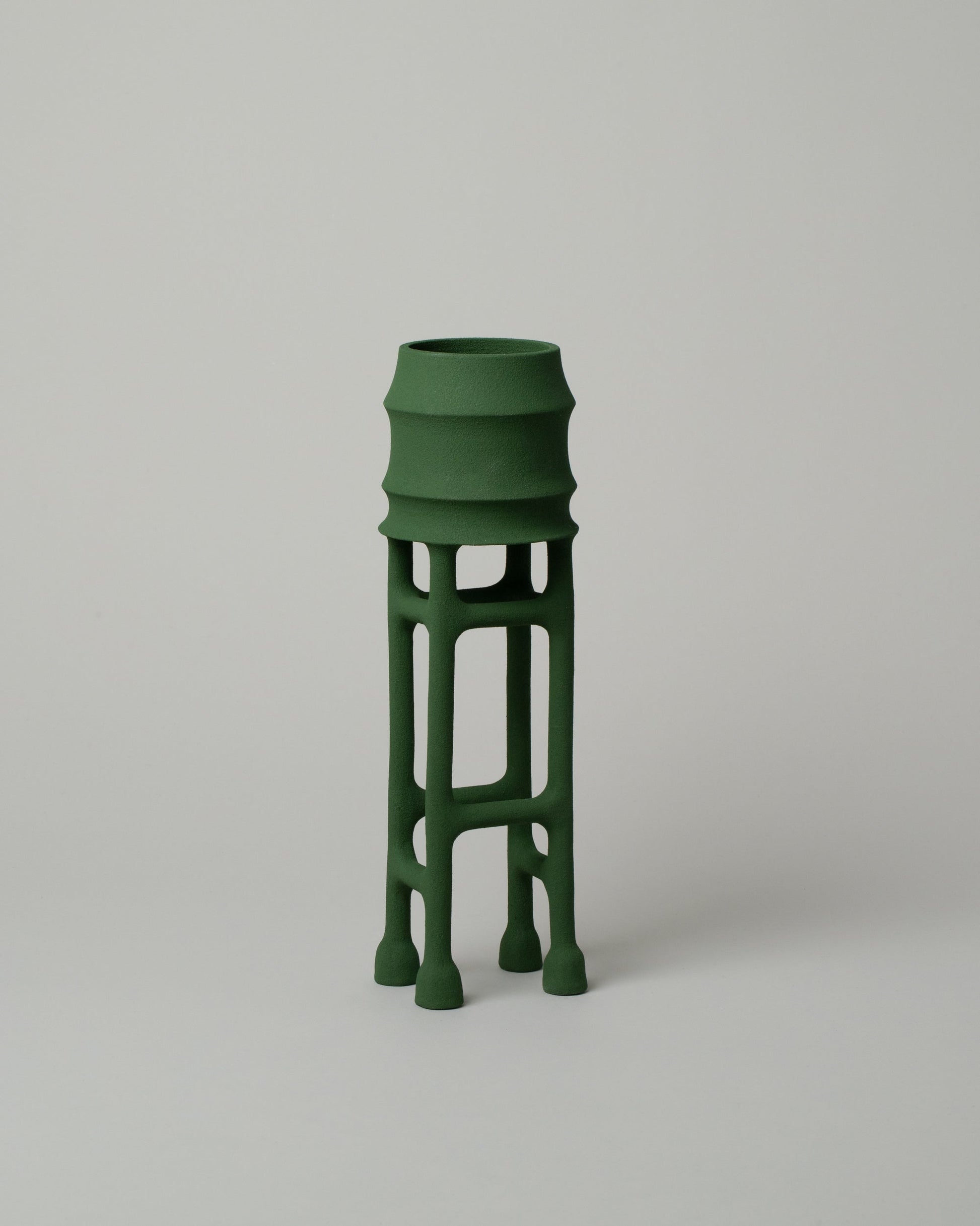  Solenne Belloir Forest Green Water Tower on light color background.