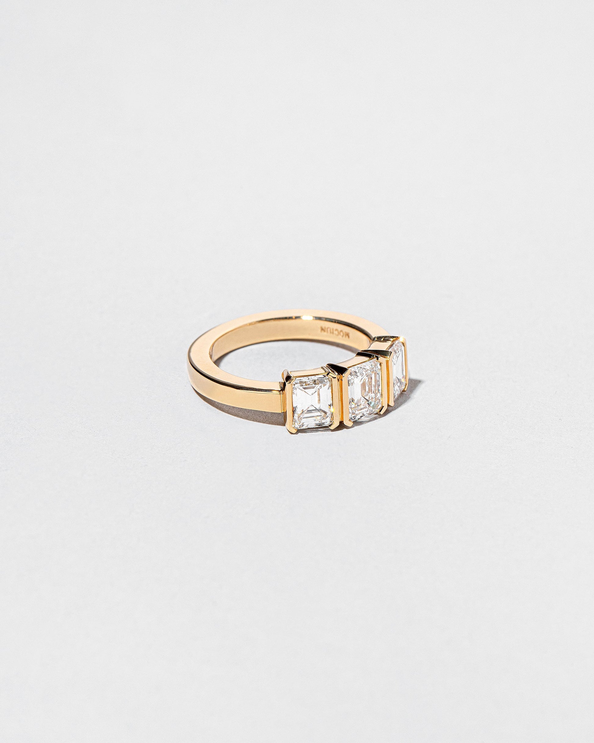  The Puritan 3 Ring on light color background.