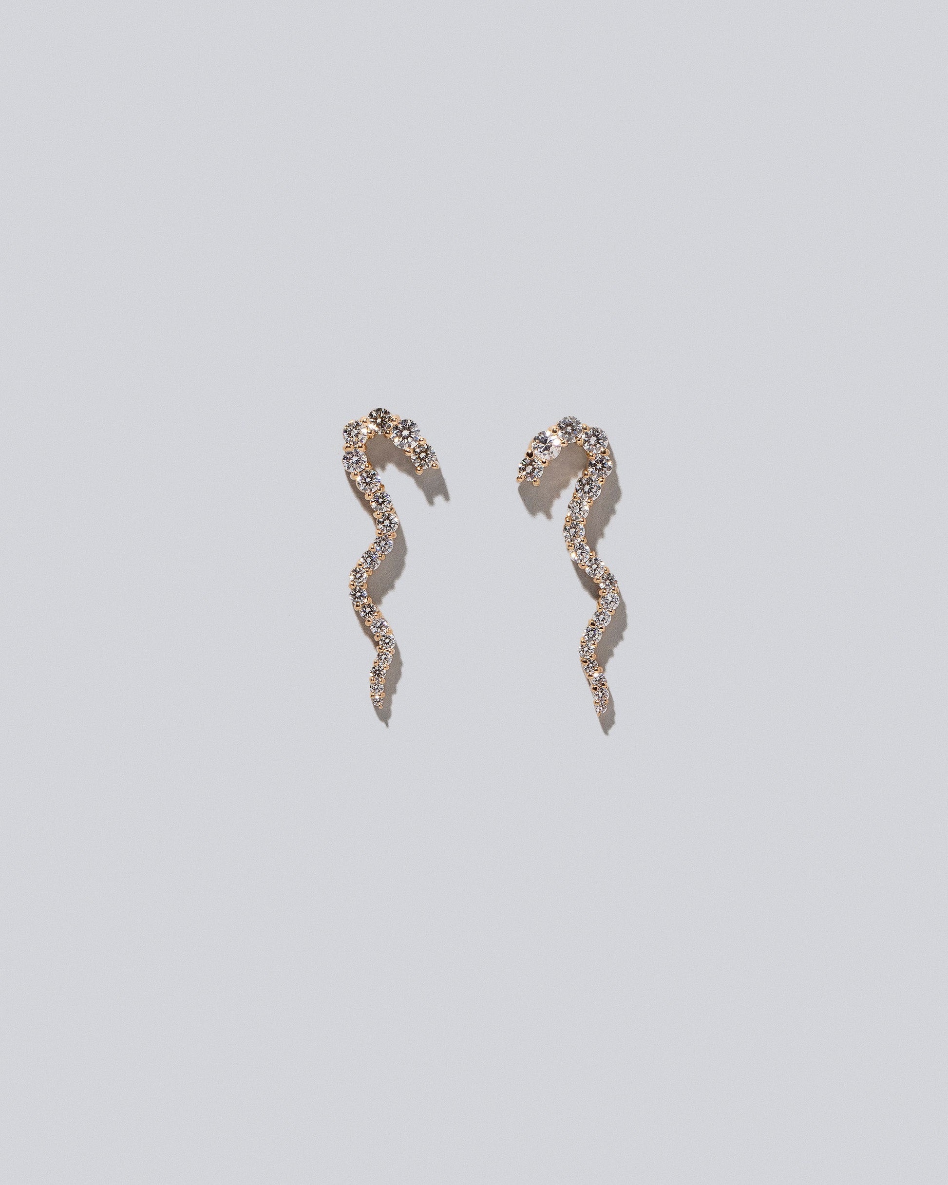 Ripple Wave Single Earrings on light color background.