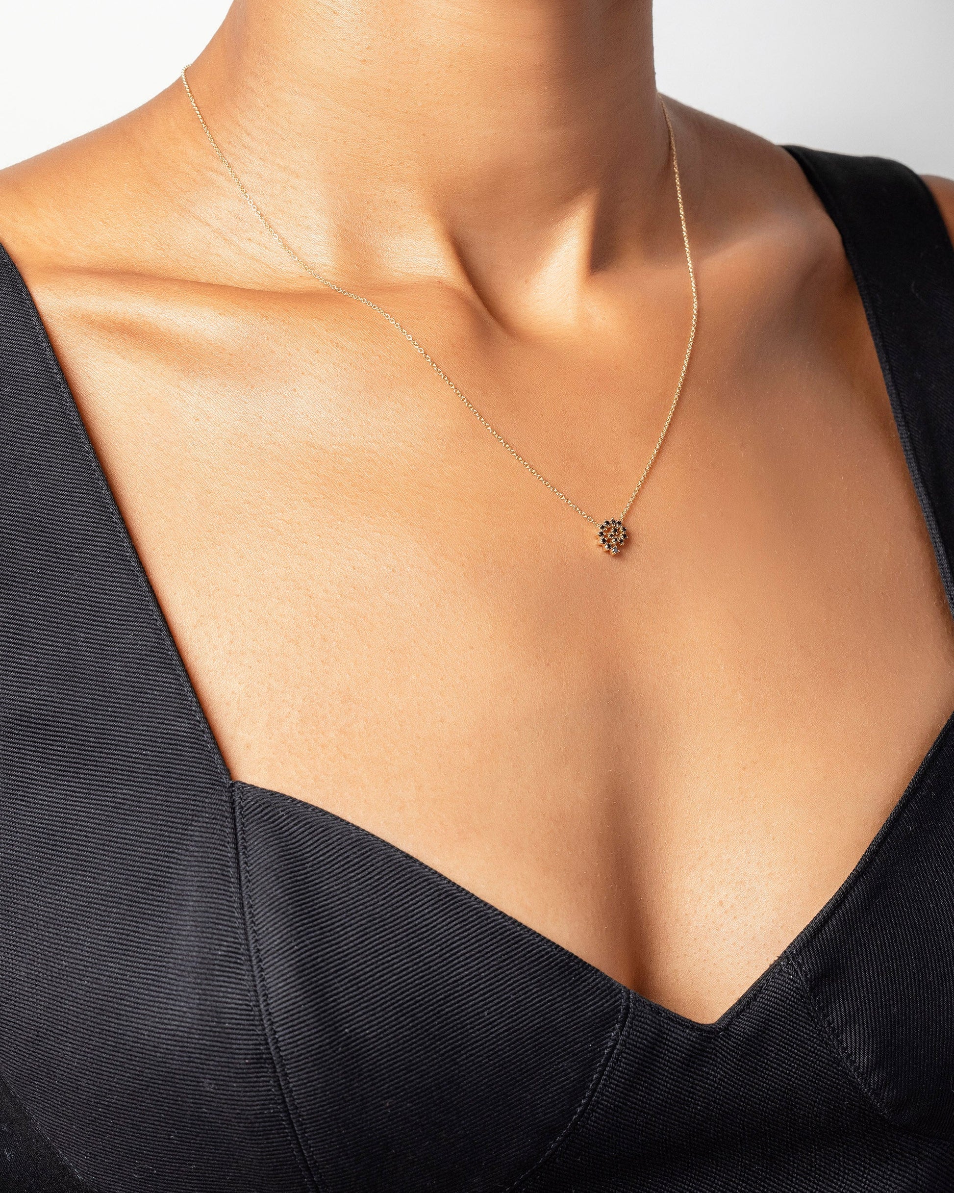 Mini Black Diamond Spiral Necklace on model.