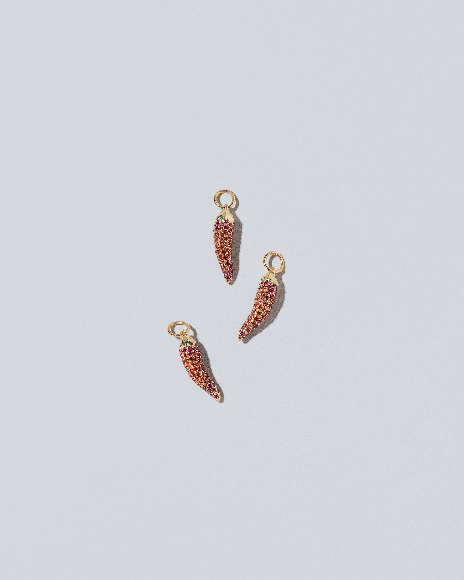 Chili Pepper Charm - Pavés on light color background.