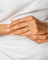 Gold Emerald Connection Band on model.