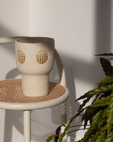 Styled image of the Stephanie Phillips Cream Rattan Vessel.