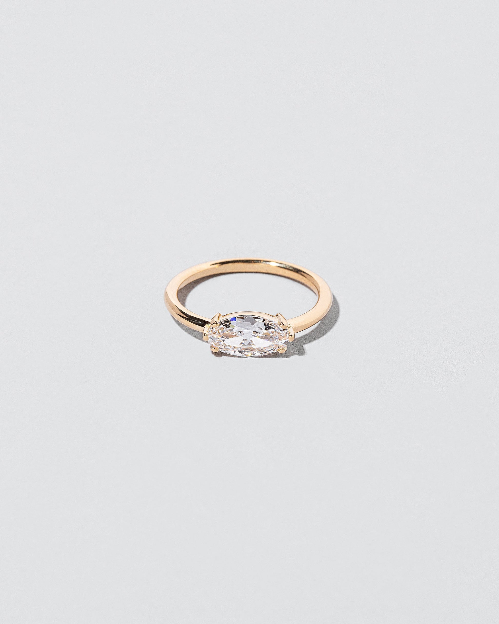  Elixer Ring on light color background.