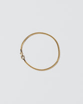 2.4mm Curb Chain Bracelet on light color background.