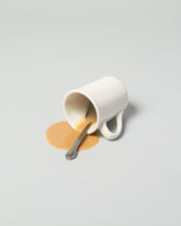 Spills Faux Diner Coffee Mug Spill on light color background.