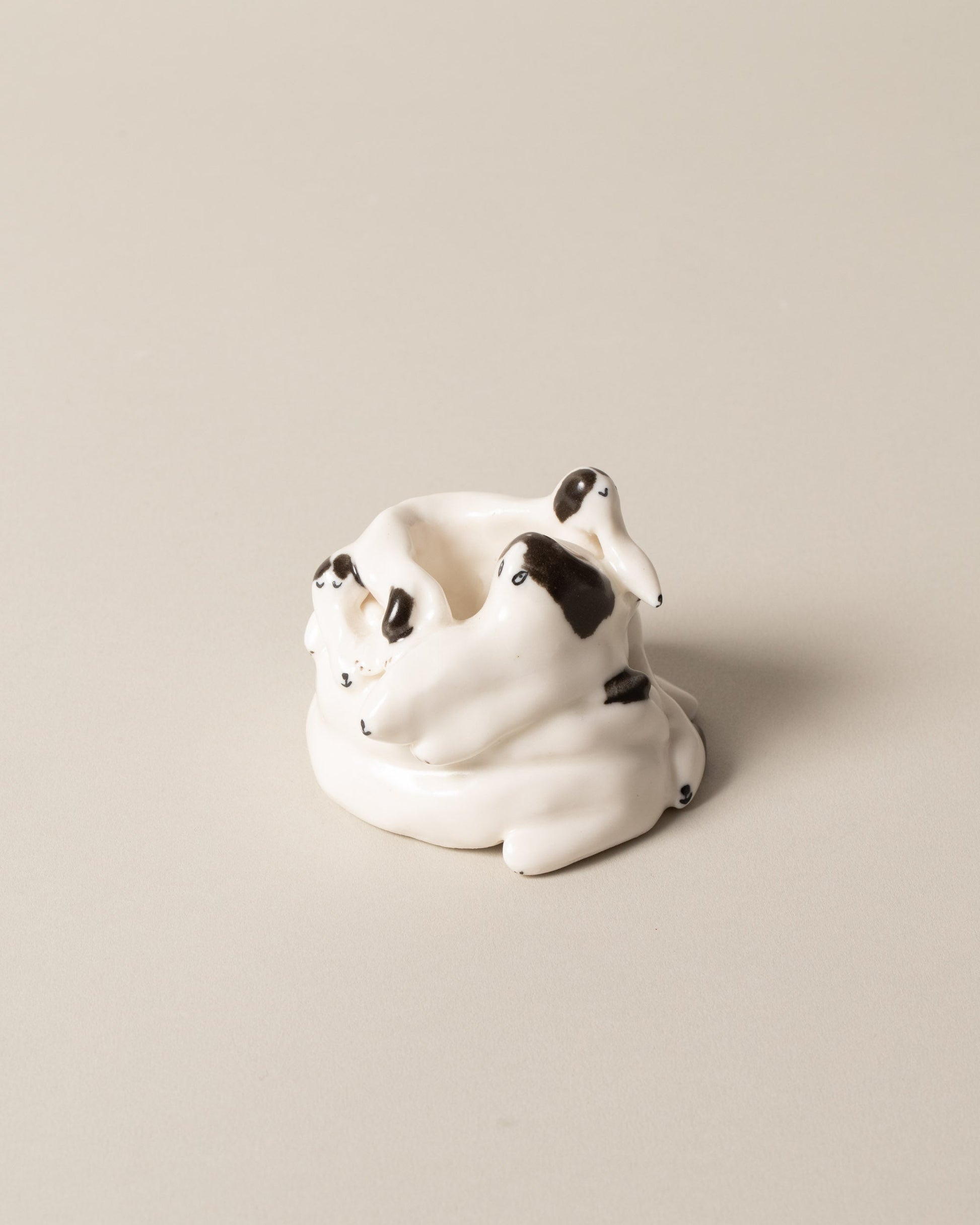 View from the back of the Eleonor Boström Spots Dog Pile on light color background.